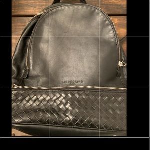 New never used small/medium leather backpack.